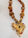 Necklace with a gold heart pendant and brown beads on a white background